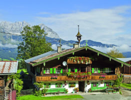 16870620 - mountain farm in tyrol before the panorama of the wilder kaiser